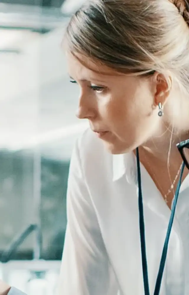 Two people discussing something on a screen