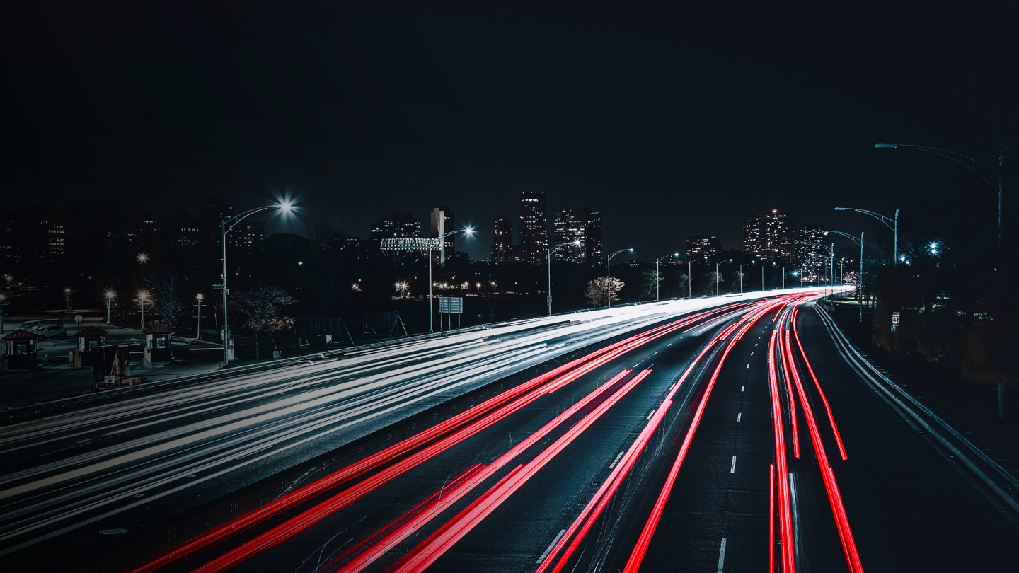 Road at night with break lights