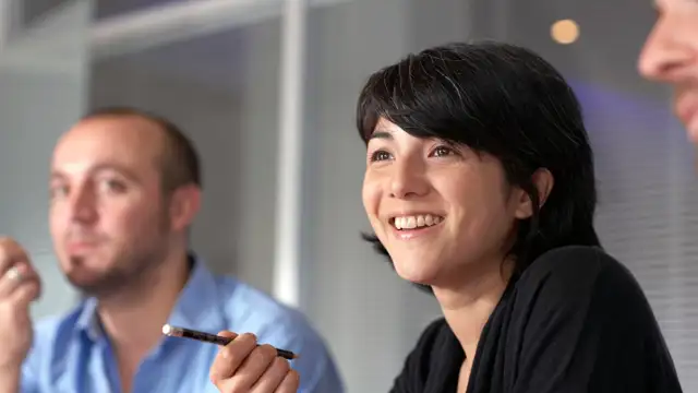 Woman participating happily in a meeting