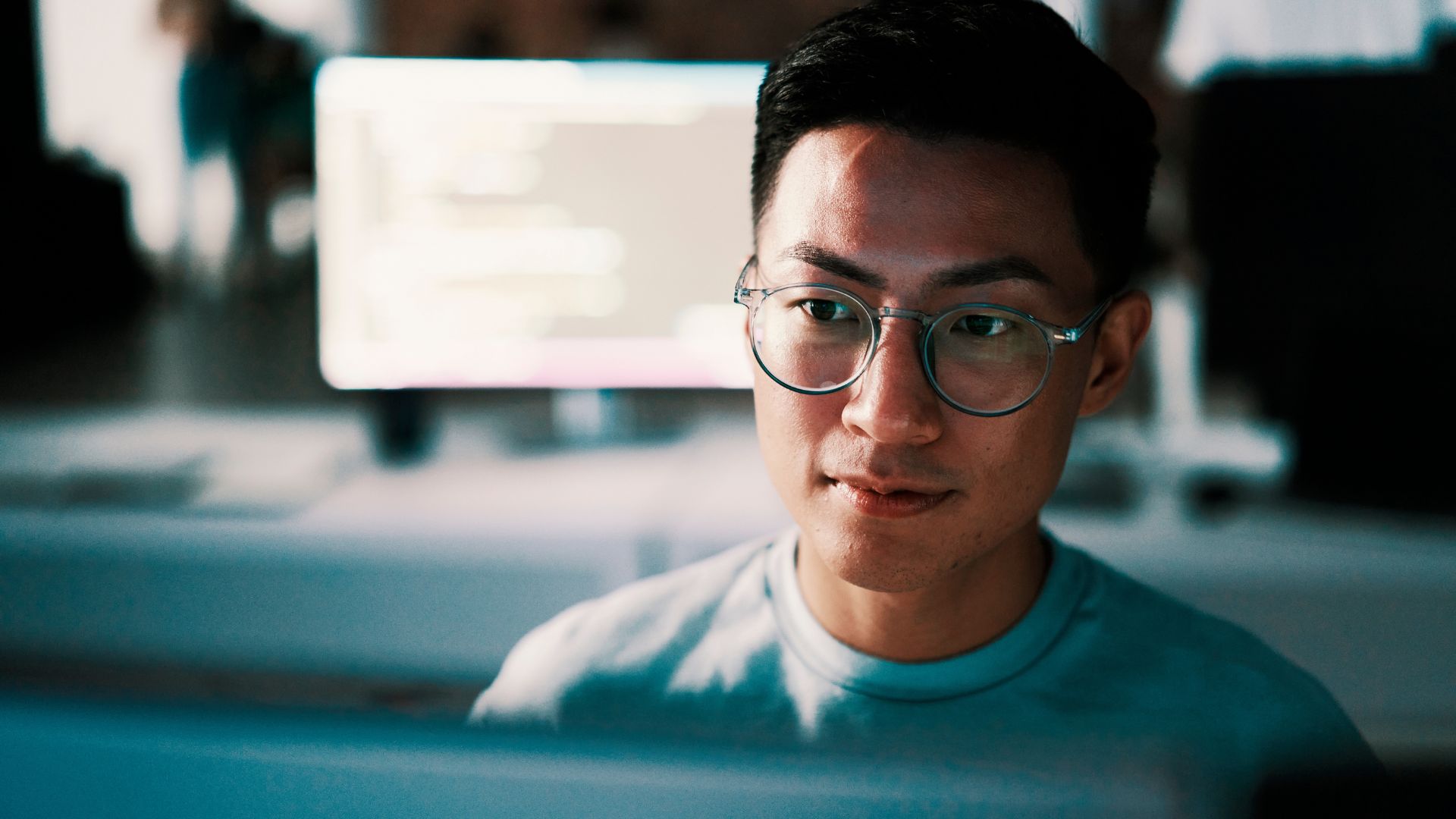 Man With Glasses In Front Of Screen