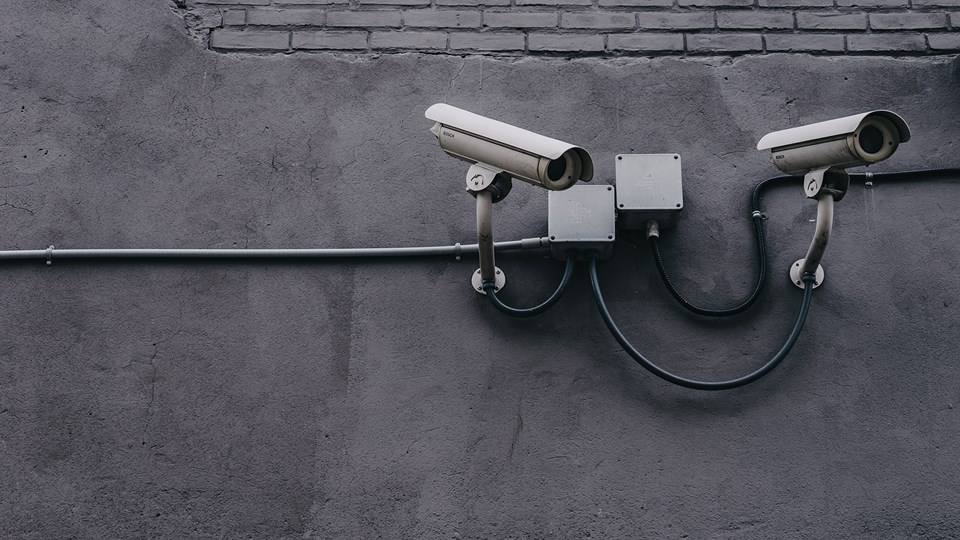 cybersecurity technology, cameras on grey wall