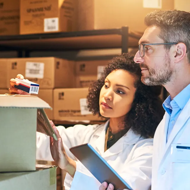 Man and woman in a packaging room
