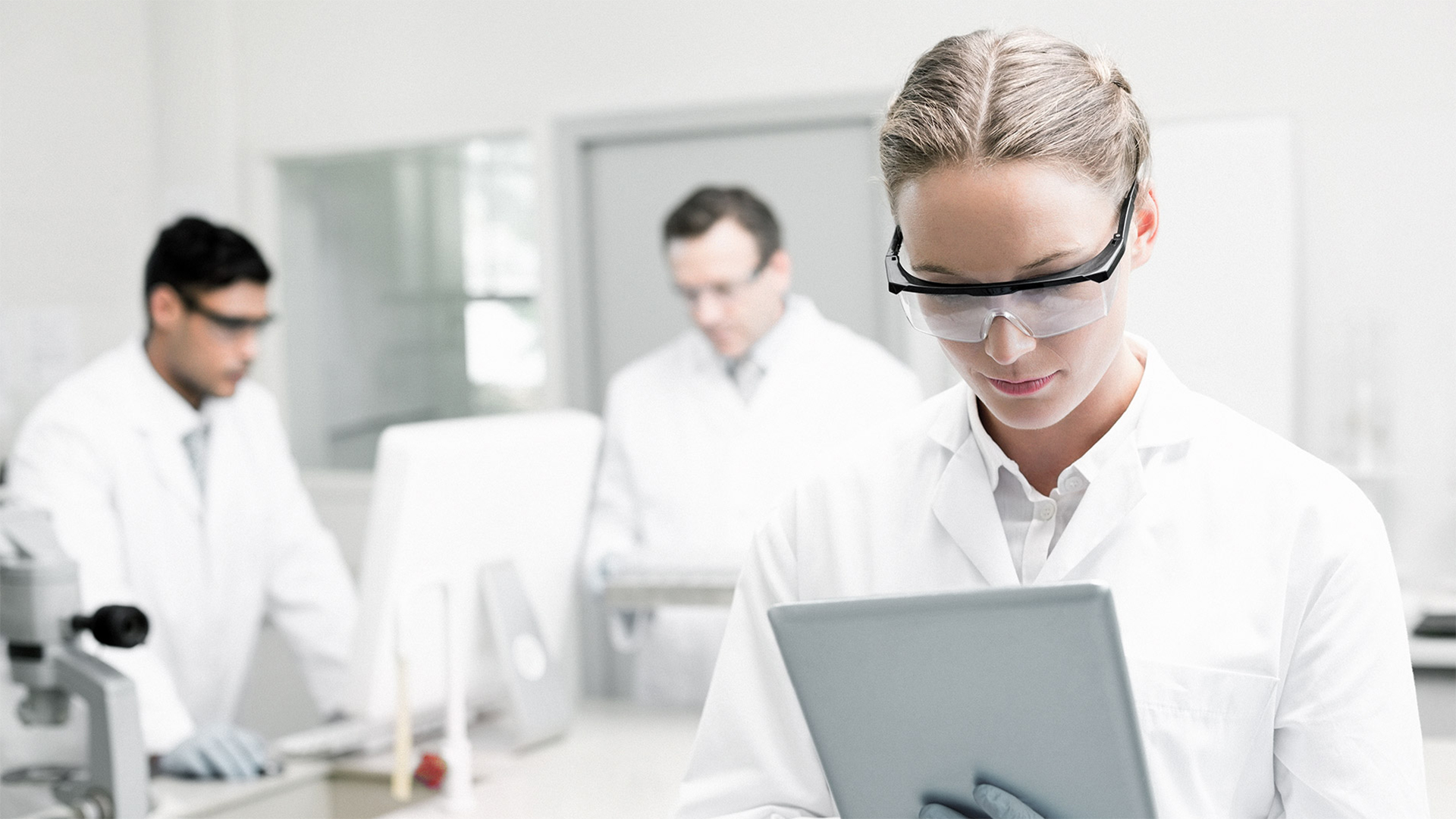 Woman looking at tablet computer in lab