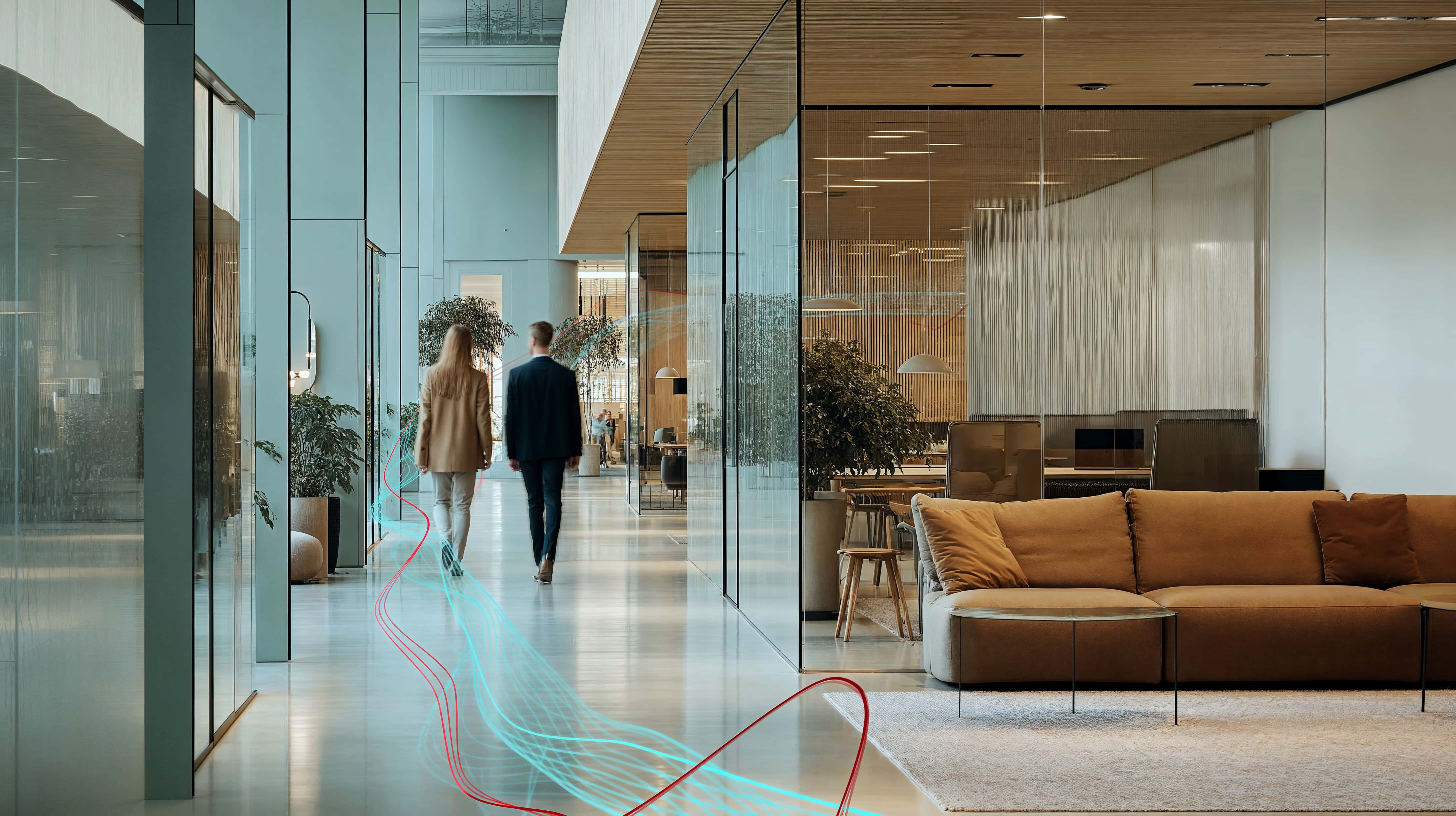 Professionals walking through a modern office with digital data flows representing AI-driven transformation.
