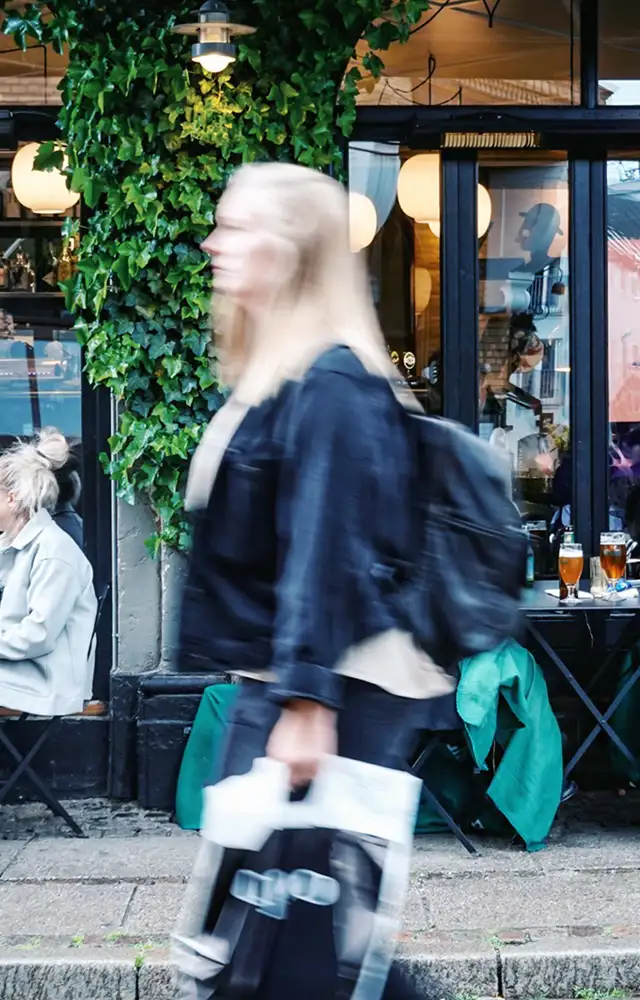 Woman walking in busy city