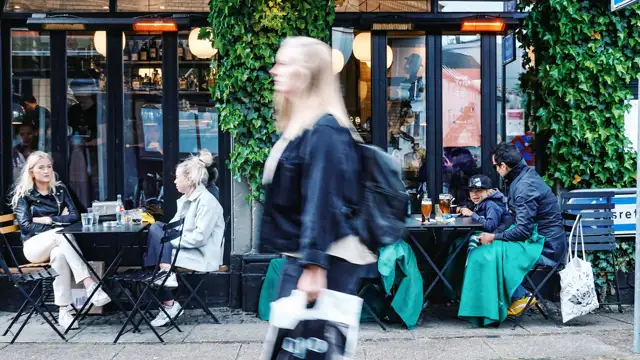 Woman walking in busy city