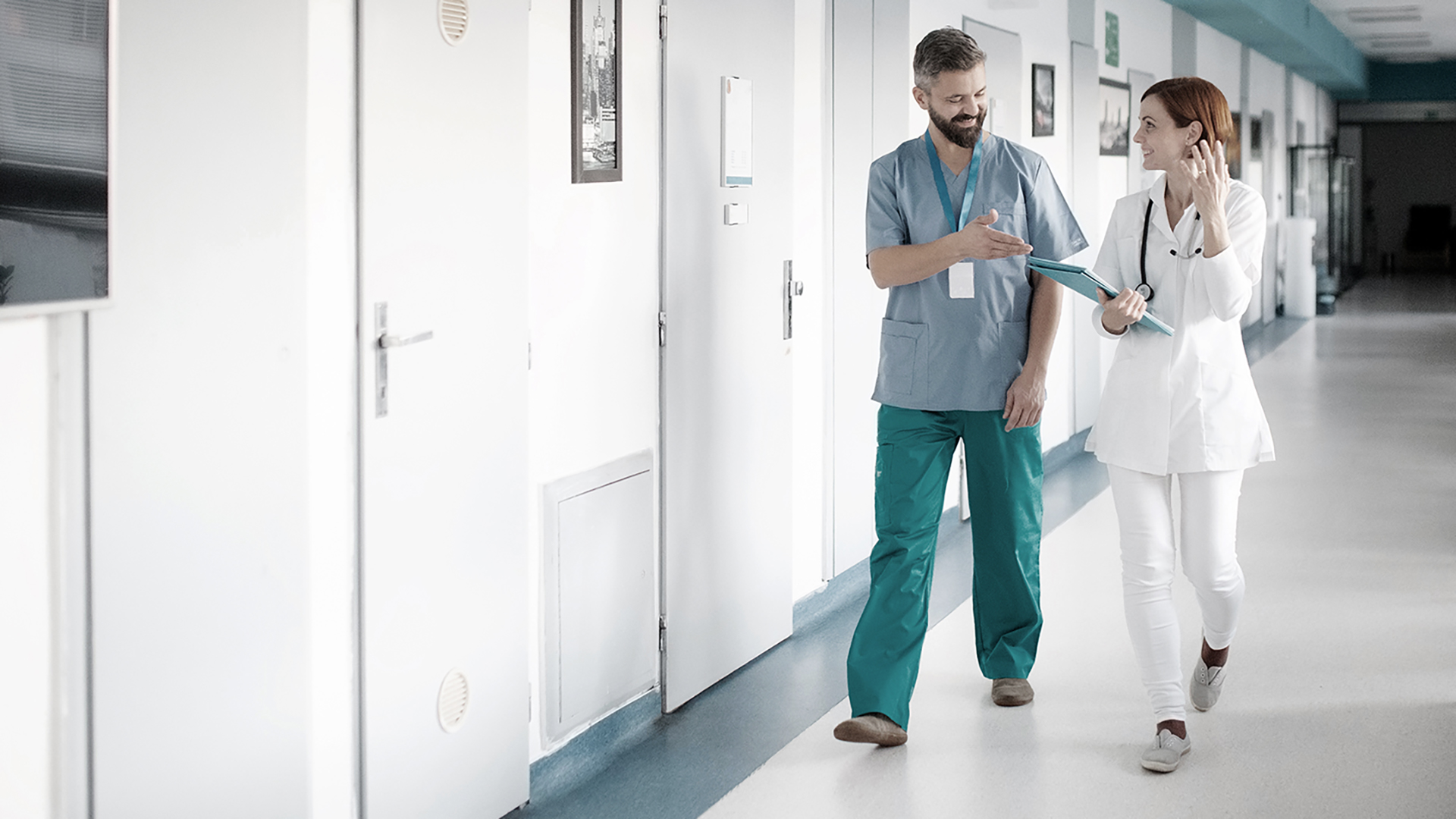 Doctors walking in hallway of hospital