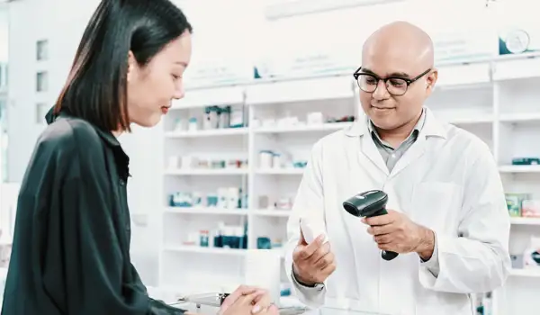 Woman buying something in a pharmacy
