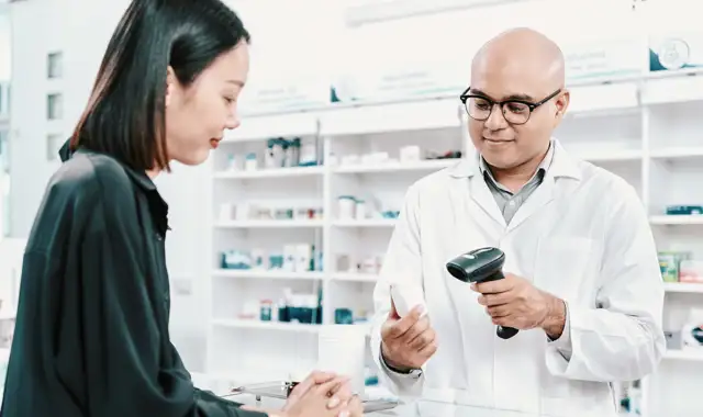 Woman buying something in a pharmacy
