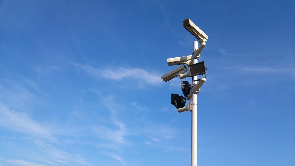 cybersecurity technology pole with cameras outdoors