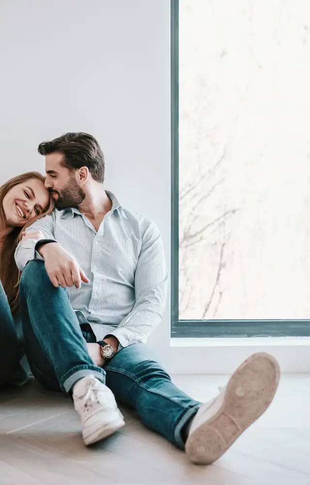 Happy couple in new apartment