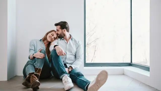 Happy couple in new apartment